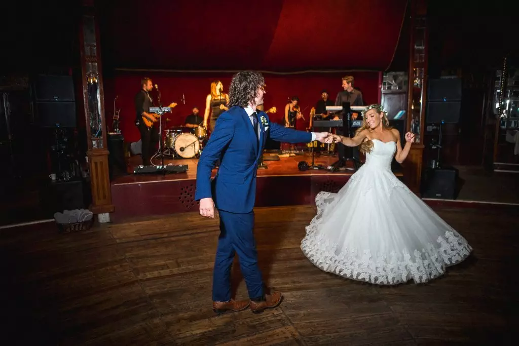 bride and groom first dance with the best twirling dress ever