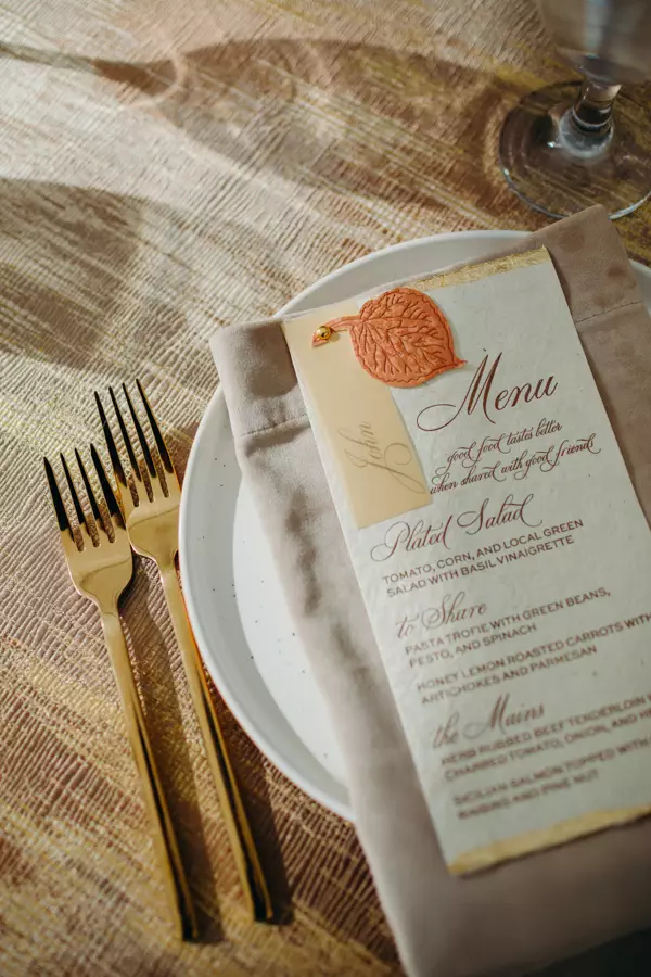 place setting fall colors and gold silverware